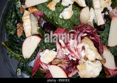 Beetroots leaves salad with hot goat cheese Stock Photo