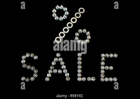 Word sale with sign percent lined with screws letters on black background. Sales creative concept in 3D metal font close-up for hardware store. Mockup Stock Photo