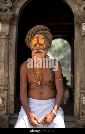 Portrait of sadhu at Pashupatinath Temple. In Hinduism, the sadhu is solely dedicated to achieving moksha (liberation) through meditation and contempl Stock Photo