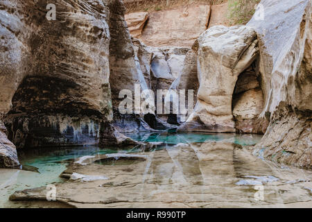 The Subway complete with turquoise waters and towering cliffs in the Zion Wilderness of Zion National Park in Utah, USA Stock Photo