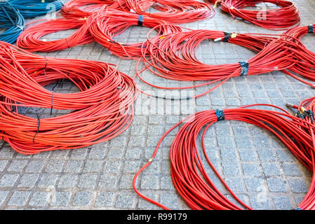 Large rolls of data cables ready to connect television data center during the retransmission of an event. Stock Photo