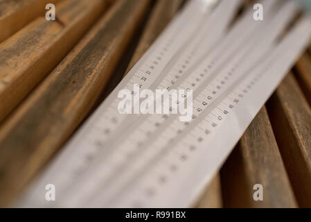 Strips of paper to measure metric distances. Stock Photo