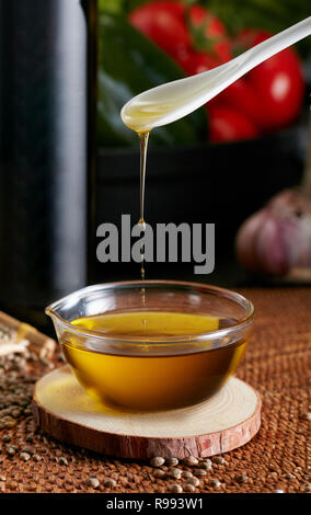 Closeup of fresh organic extra virgin olive oil in kitchen Stock Photo