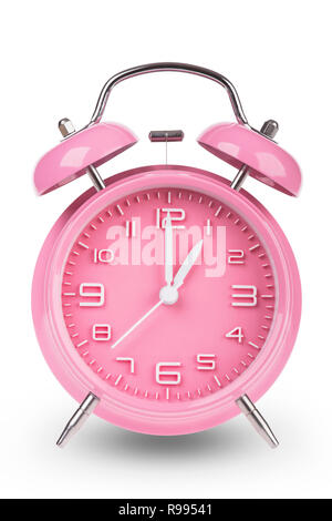 Pink alarm clock with the hands at 1 am or pm isolated on a white background. Stock Photo