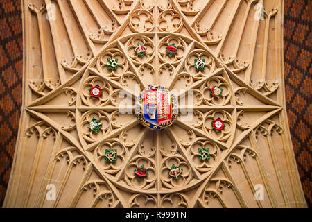 LONDON, UK - May 11, 2018. Crest on ceiling Hampton Court Palace which was originally built for Cardinal Thomas Wolsey 1515, later became King Henry V Stock Photo