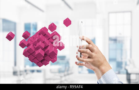 Integrating new technologies concept with cube figure floating i Stock Photo