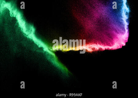 Abstract Multicolored sand explosion isolated on black background. Abstract sand cloud. Sandy fly wave in the air. Stock Photo