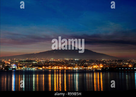 Etna and Catania at sunset Stock Photo