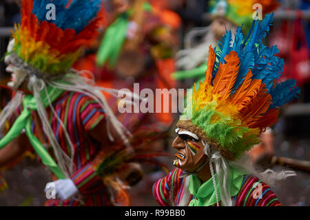 Tobas dancers in colourful costumes performing at the annual Oruro Carnival. Stock Photo