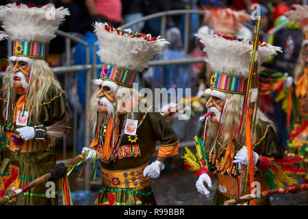 Tobas dancers in colourful costumes performing at the annual Oruro Carnival. Stock Photo