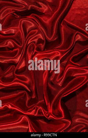 Background of red satin fabric. Shiny silk backdrop Stock Photo - Alamy