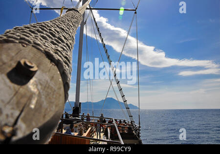 The mast of the ship, which goes to Mount Athos on a background of the blue sky Stock Photo