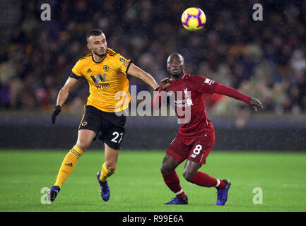 Wolverhampton Wanderers' Romain Saiss (left) and Liverpool's Naby Keita battle for the ball during the Premier League match at Molineux, Wolverhampton. Stock Photo