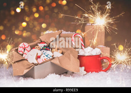 Christmas gingerbread in a box, hot chocolate with marshmallows, sparklers and candy. Merry Christmas and Happy New Year Stock Photo