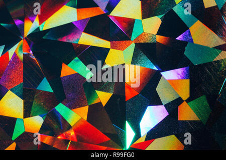 Holographic geometry. Colorful lights, festive background. Holiday concept. Perfect backdrop for your design. Stock Photo