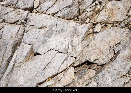 shattered natural white rock background with cracks Stock Photo