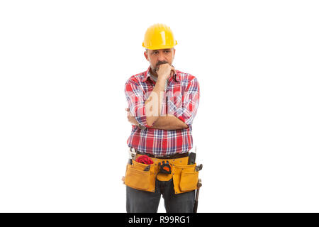 Focused builder touching chin with hand as planning or thinking concept isolated on white background Stock Photo