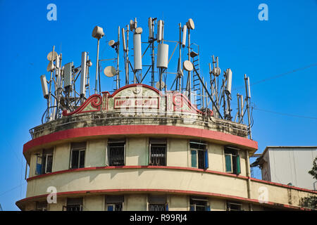 A building in Mumbai, India, with a jumble of telecommunication transponders and antennas on the roof Stock Photo