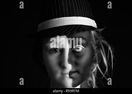 Yin / Yang - Studio portrait of a face painted young woman Stock Photo