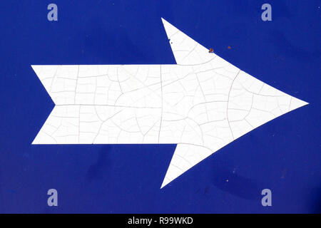 White arrow on blue background Stock Photo