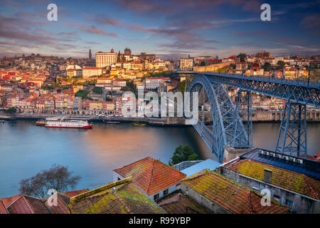 Porto, Portugal. Aerial cityscape image of Porto, Portugal with the Douro River and the Luis I Bridge during sunrise. Stock Photo