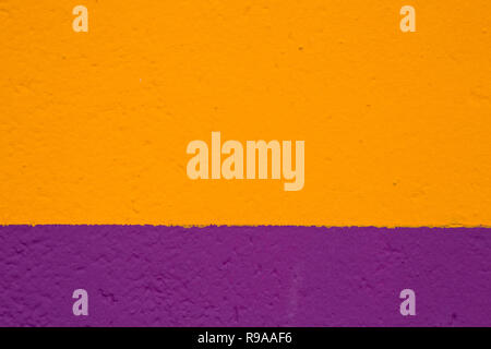 texture painted wall in yellow and purple color Stock Photo