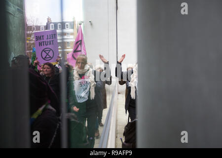 London, UK. 21st December, 2018. Extinction Rebbelion protesters bash the walls of the BBC in London Credit: George Cracknell Wright/Alamy Live News Stock Photo