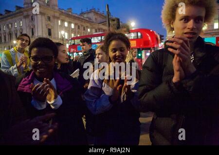 London, UK. 21st December 2018. Young activist group  Reroot ED protest outside Parliament on the last day of school.The aim of the rally is to bring about 'Critical teaching of Migrant [plus] colonial histories in British schools. Credit: Iwala/Alamy Live News Stock Photo