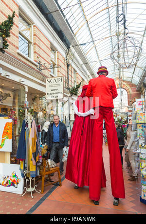 Westbourne, Bournemouth, Dorset, UK. 22nd Dec, 2018. Victorian style theatre with mesmerising walkabouts, irresistable characters and inspirational performers at Westbourne spread seasonal cheer on the last weekend before Christmas. Stlitwalkers in the Victorian arcade. Credit: Carolyn Jenkins/Alamy Live News Stock Photo