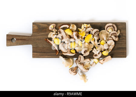 Variety of mixed exotic mushrooms on a cutting board. Stock Photo