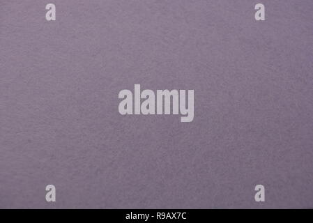 Interesting structural material structured background of yellow, purple and rose-colored, synthetic fabric. Stock Photo