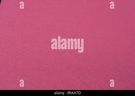 Interesting structural material structured background of yellow, purple and rose-colored, synthetic fabric. Stock Photo