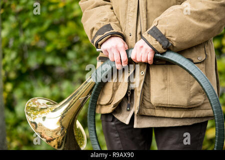 French horn band held in hands by a hunter on Saint Hubertus Day, 05/11/2017, De Moer, The Netherlands Stock Photo