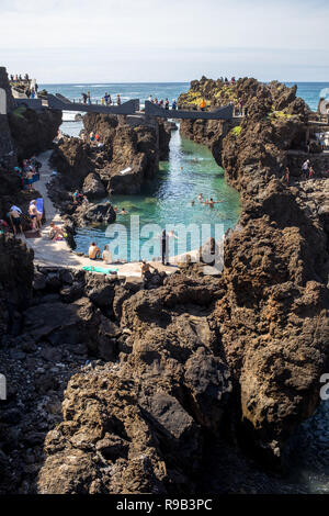 Porto Moniz, Madeira, Portugal - April 18, 2018: Natural rock pool of Porto Moniz on Madeira Island. Portugal.  It is a public bath with water from th Stock Photo