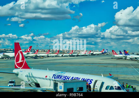 Istanbul, Turkey-October 10, 2017: Turkish Airlines planes waiting for passengers on the tarmac near renovated airport terminal Stock Photo