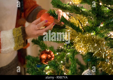 Woman decorating Christmas tree. Spanish tradition for Christmas. Stock Photo
