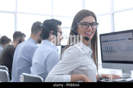 employee of the business center using the computers to analyze the data Stock Photo