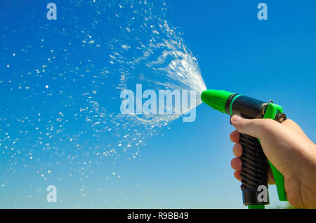 hand with water spray jet Stock Photo