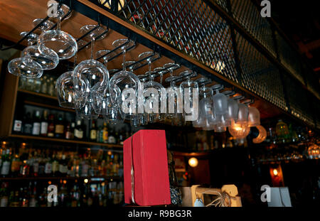 glasses hanging over the bar Stock Photo