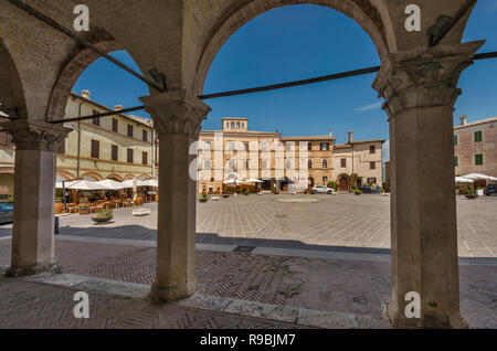 Piazza del Comune, arcades at Palazzo Comunale (Town Hall), in historic center of Montefalco, Umbria, Italy Stock Photo