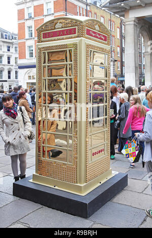 LONDON, UNITED KINGDOM - JUNE 23: Telephone booth in London on JUNE 23, 2012. Ted Baker Phone Box to celebrate ChildLine 25th anniversary at Covent Ga Stock Photo