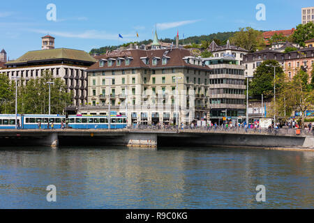 Zurich, Switzerland - May 25, 2016: buildings of the historic part of the city of Zurich, people on the embankment of the Limmat river. Zurich is the  Stock Photo