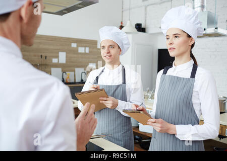 Trainees making notes Stock Photo
