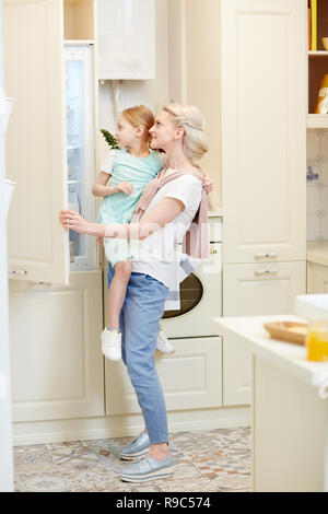 Looking into fridge Stock Photo