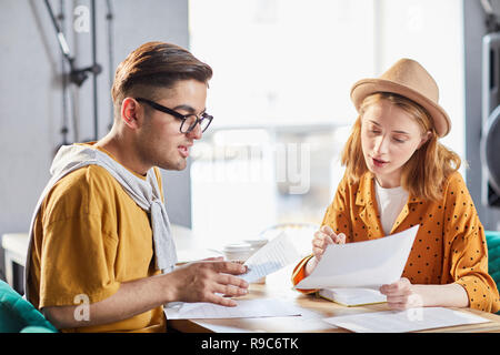 Colleagues discussing papers Stock Photo