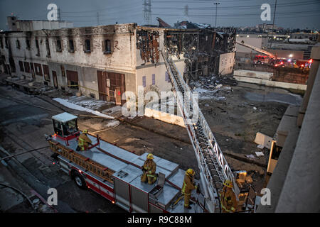 Fire fighters putting out warehosue fire in Downtown Los Angeles near 1st Street Bridge, California, USA Stock Photo