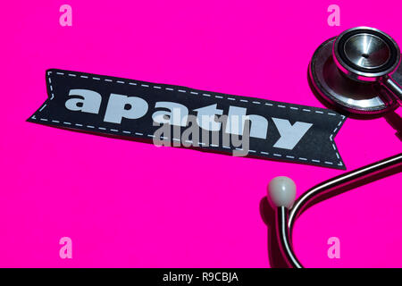 Apathy on the paper with healthcare concept. With stethoscope on pink bakcground Stock Photo