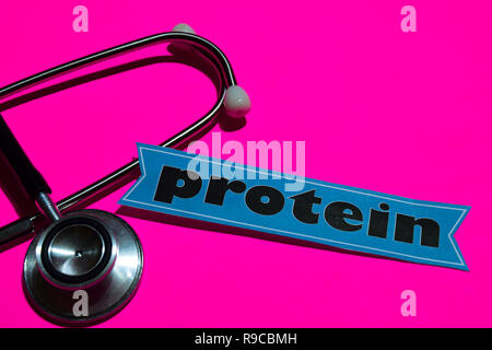 Protein on the paper with healthcare concept. With stethoscope on pink bakcground Stock Photo