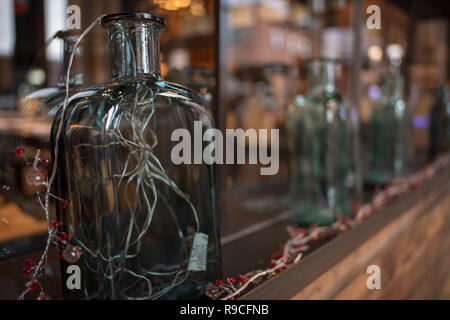 Antique Glass bottles on shelf as ornaments Stock Photo