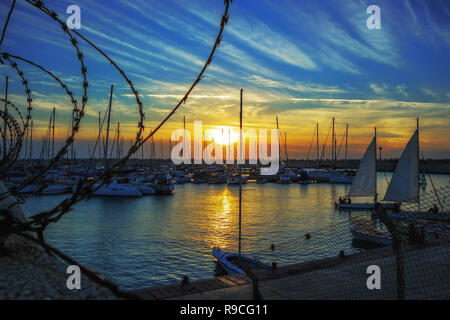 look at the yacht club in the evening because of the barbed wire in Ashdod Stock Photo